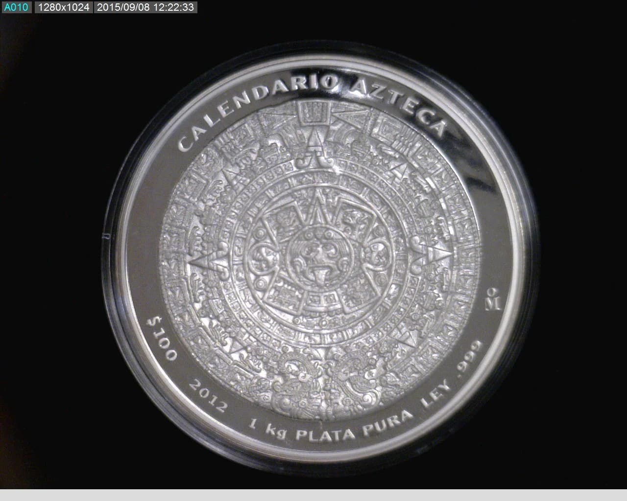 100 Pesos 1 Kilogramo, Calendario Azteca, Mate-brillo 2012 · Reverso