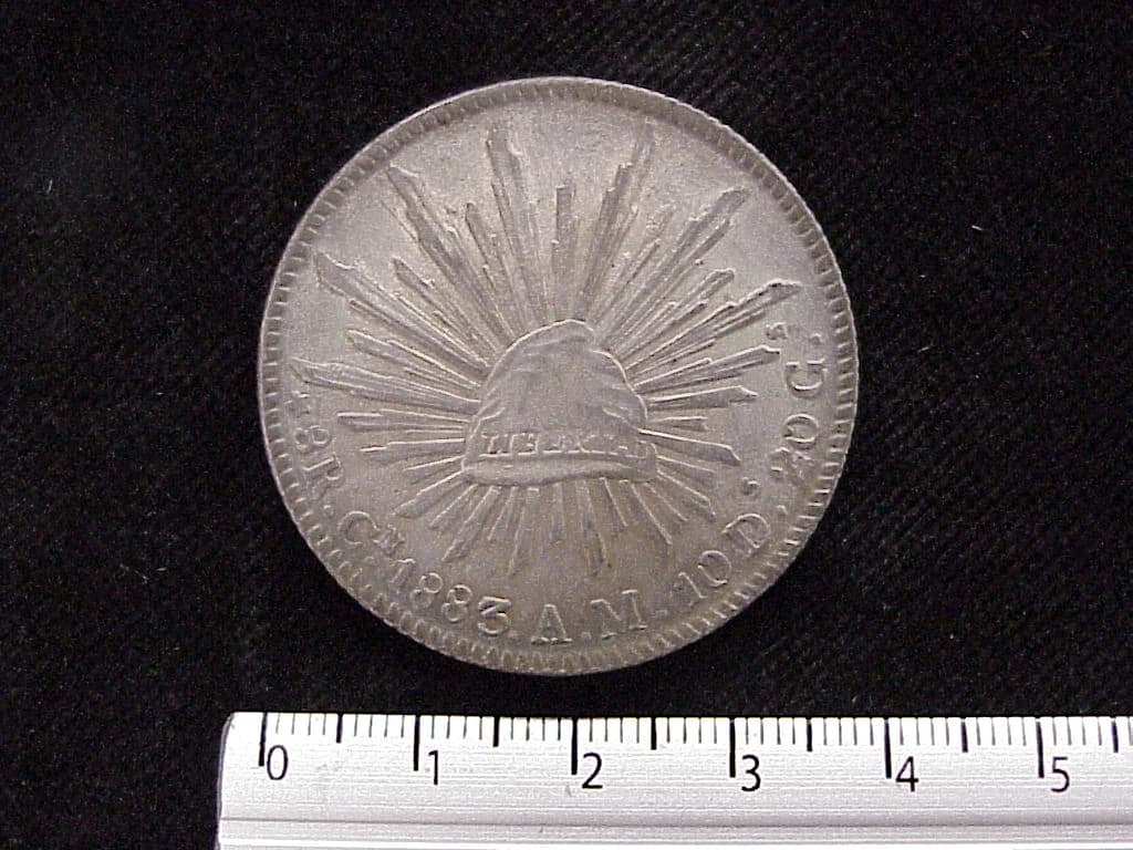 8 Plata 1883 . Inventario Banxico 6034 (reverso)