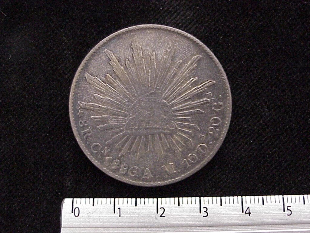 8 Plata 1886 . Inventario Banxico 6046 (reverso)