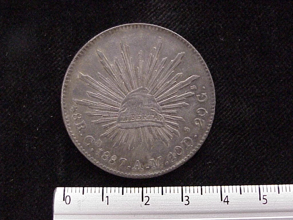 8 Plata 1887 . Inventario Banxico 6050 (reverso)